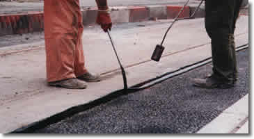 Densoband being applied to Sheffield Superfield Trams, UK between the tarmac and rails