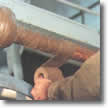 denso tape being applied to a water pipe