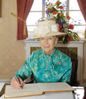 HRH Princess Alexandra signing the visitors book.