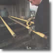 Denso PVC Tape being applied over pipes protected with Denso Tape