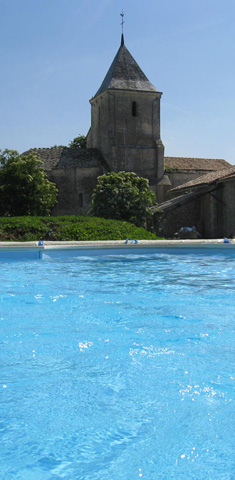 Picture of the view from the heated swimming pool looking towards the church