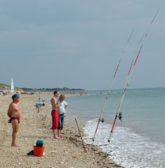 Picture of men fishing on one of Ile de Re's beaches.