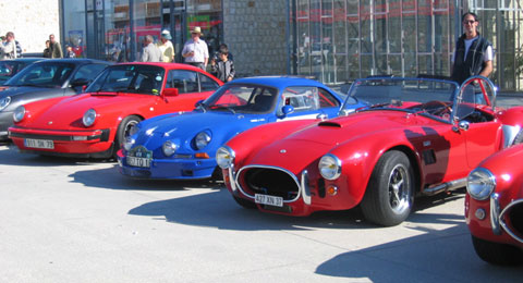 a line up of enthusiast's cars